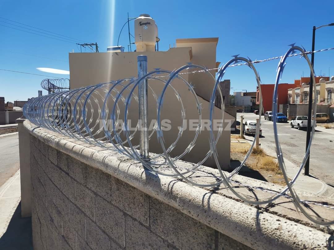 Instalación de concertina en muro